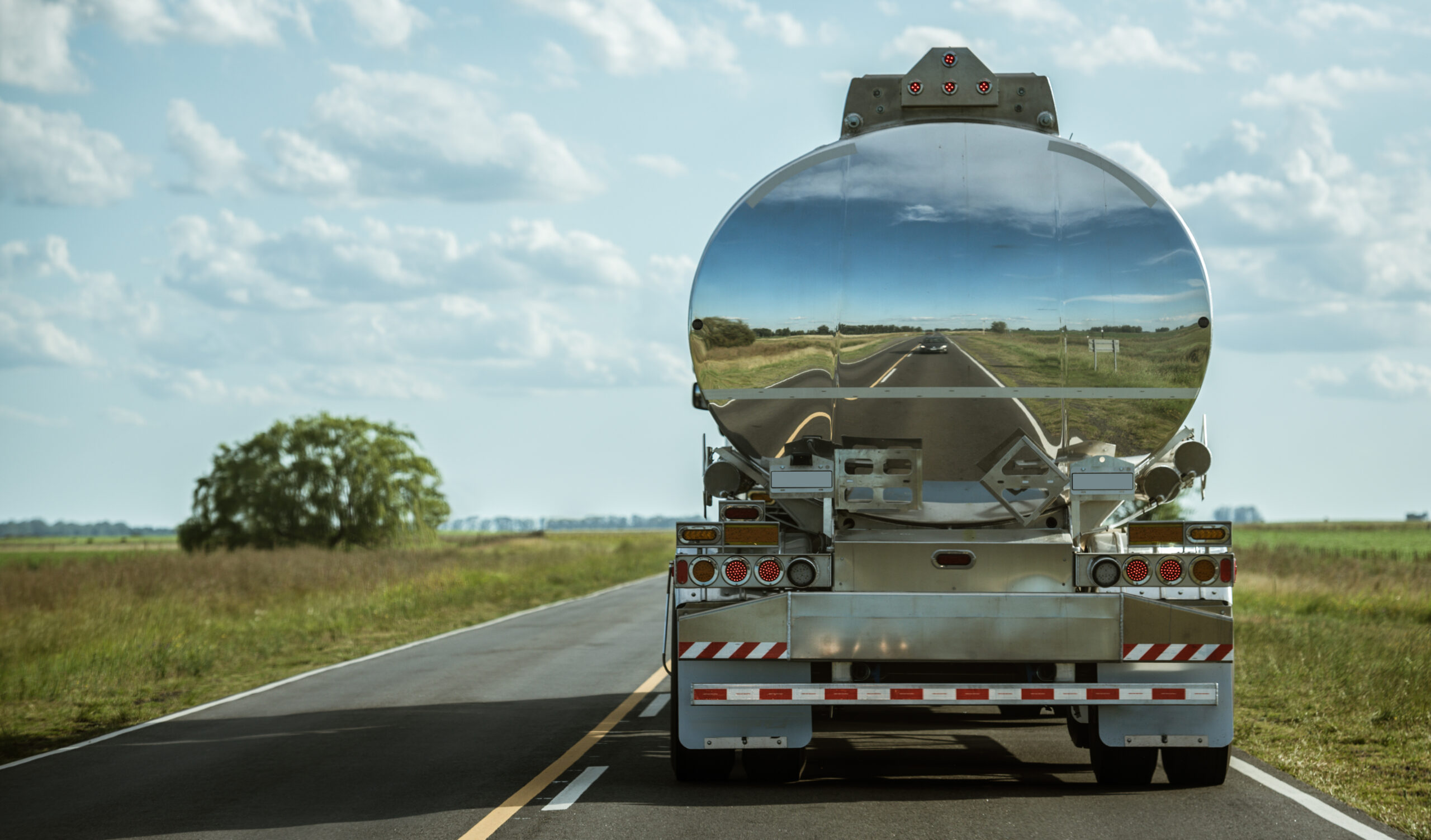 A,Truck,Tank,Of,Gasoline,With,Reflection,On,The,Road Tanker Trailer